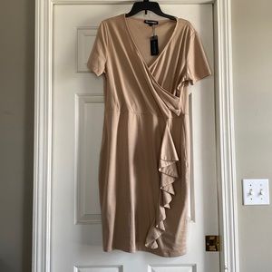 New with tags, light weight, soft, deep V neck dress with ruffle along left hip